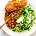 Realistic overhead image of Vegan Meal Prep Ideas in containers for the week