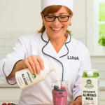 Chef Luna pouring Califia Organic Almond Milk into a smoothie glass filled with berries