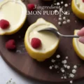 op-down view of ingredients to make a 3-ingredient velvet lemon pudding, including three fresh whole lemons, a glass bowl of thick cream, sugar, and raspberries on a white marble countertop.