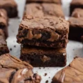 Close-up of stacked, gooey chocolate squares made from a simple nutella brownies 3 ingredients recipe.