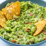 Craving the absolute best Authentic Homemade Guacamole? This simple 10-minute recipe uses fresh lime and cilantro for a perfect, restaurant-quality dip.