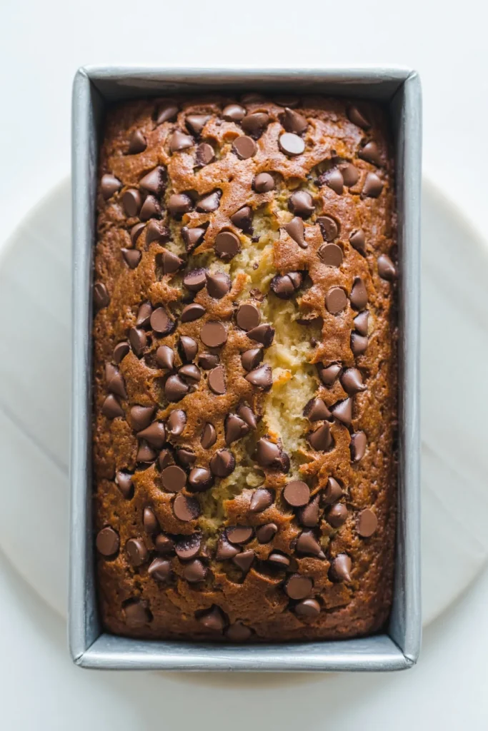 Bake the ultimate Chocolate Chip Banana Bread. This easy, moist, one-bowl recipe uses overripe bananas and semisweet chips for bakery-style perfection.