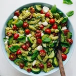 Craving the perfect summer side? This pesto pasta salad is packed with fresh flavors, juicy tomatoes, and mozzarella. Grab the easy 20-minute recipe now!
