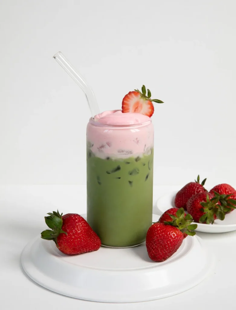 Learn how to make the perfect Strawberry Matcha Latte at home. This refreshing iced drink features a velvety strawberry cold foam and ceremonial grade matcha.