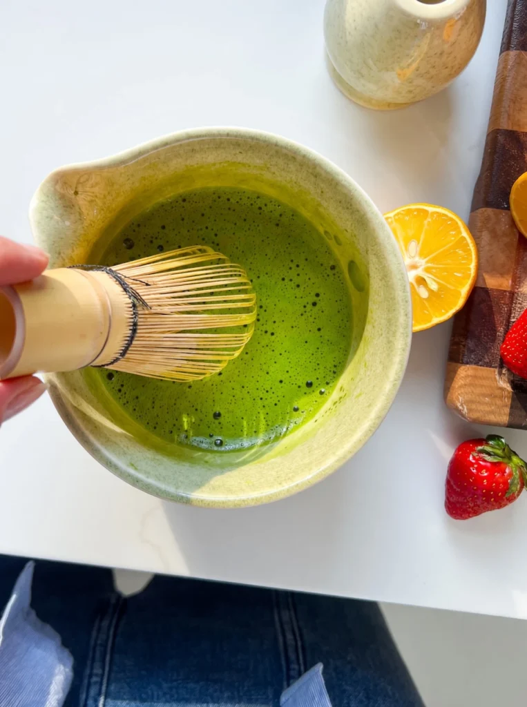 Master this strawberry matcha recipe at home. Discover the barista secrets to perfectly layered iced matcha with fresh, sweet strawberry puree.