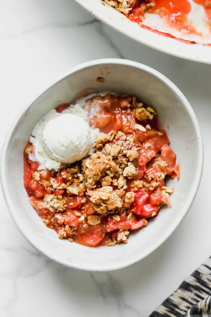 Master the perfect Strawberry Rhubarb Crisp with a flawless sweet-tart filling and golden oat crumble. A fail-proof recipe for home bakers!